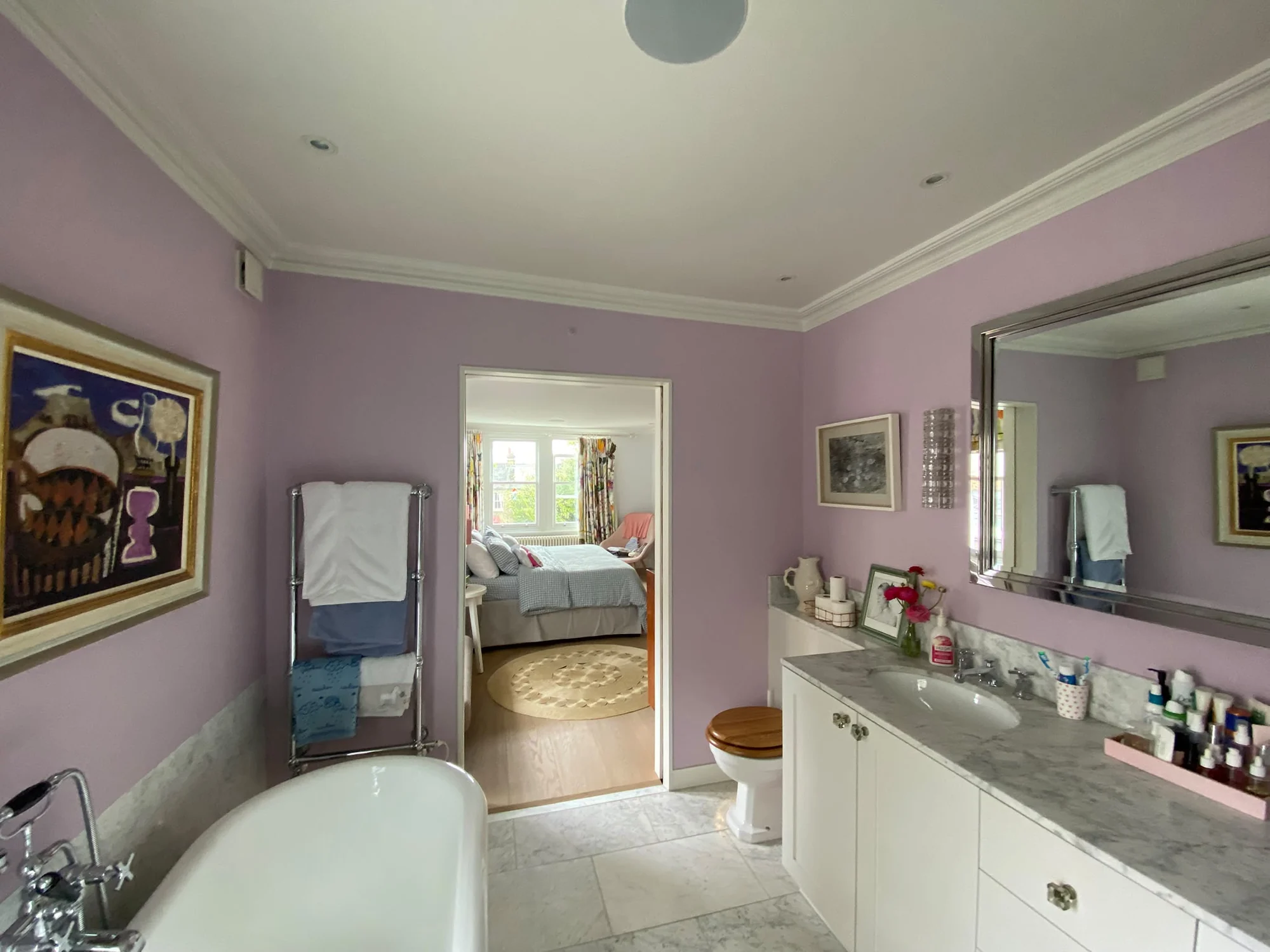 Decorated bathroom with freestanding bath and fitted vanity